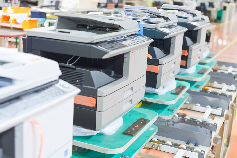 several assembled copiers on factory